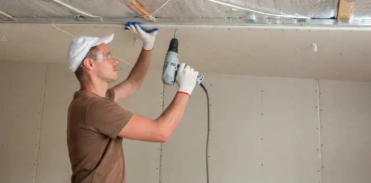 Los Angeles home remodeling contractor installing drywall during interior renovation and ceiling improvement project