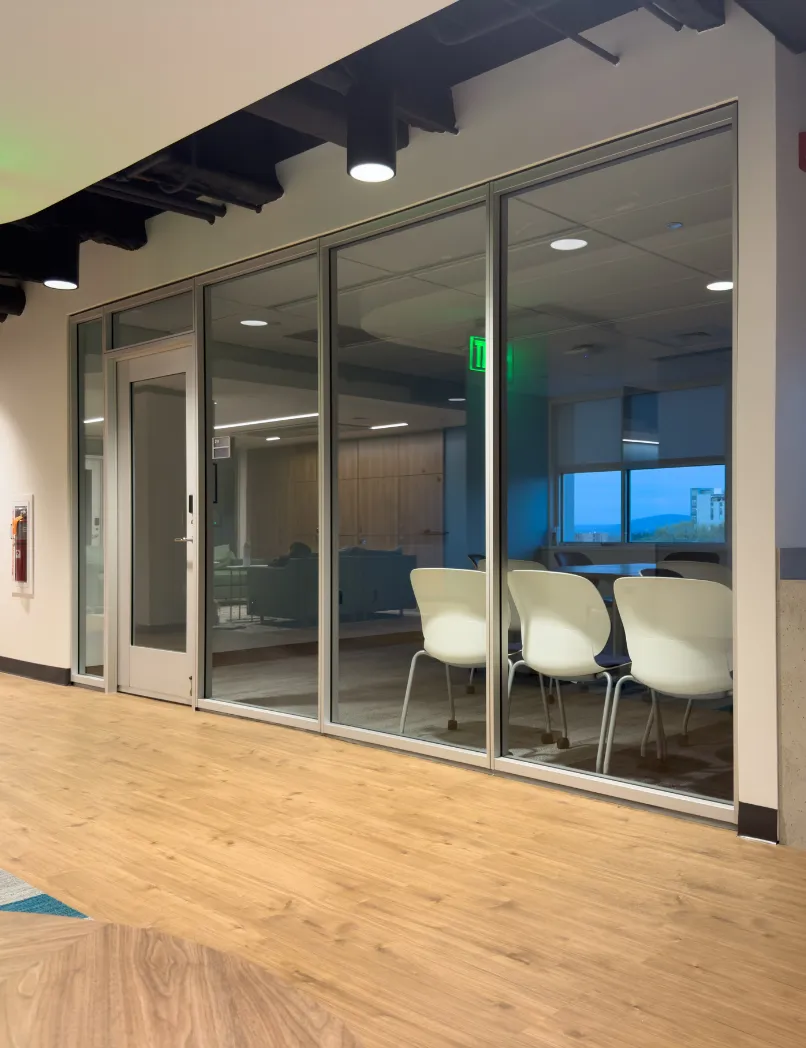Los Angeles commercial remodeling project with glass office partitions, conference room buildout, modern flooring, and finished business interior