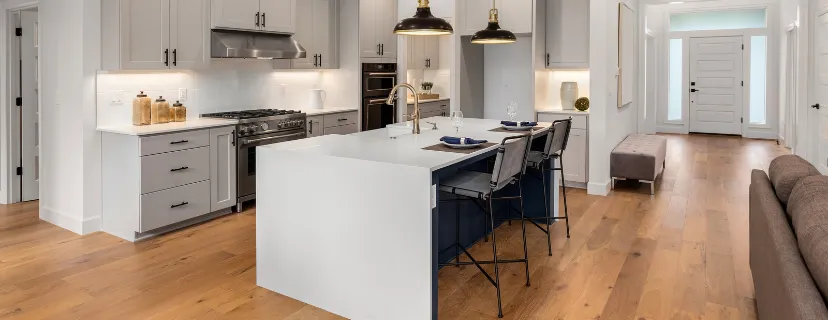 Completed Los Angeles home remodeling project with open concept kitchen, modern island, updated flooring, bright living area, and improved interior layout