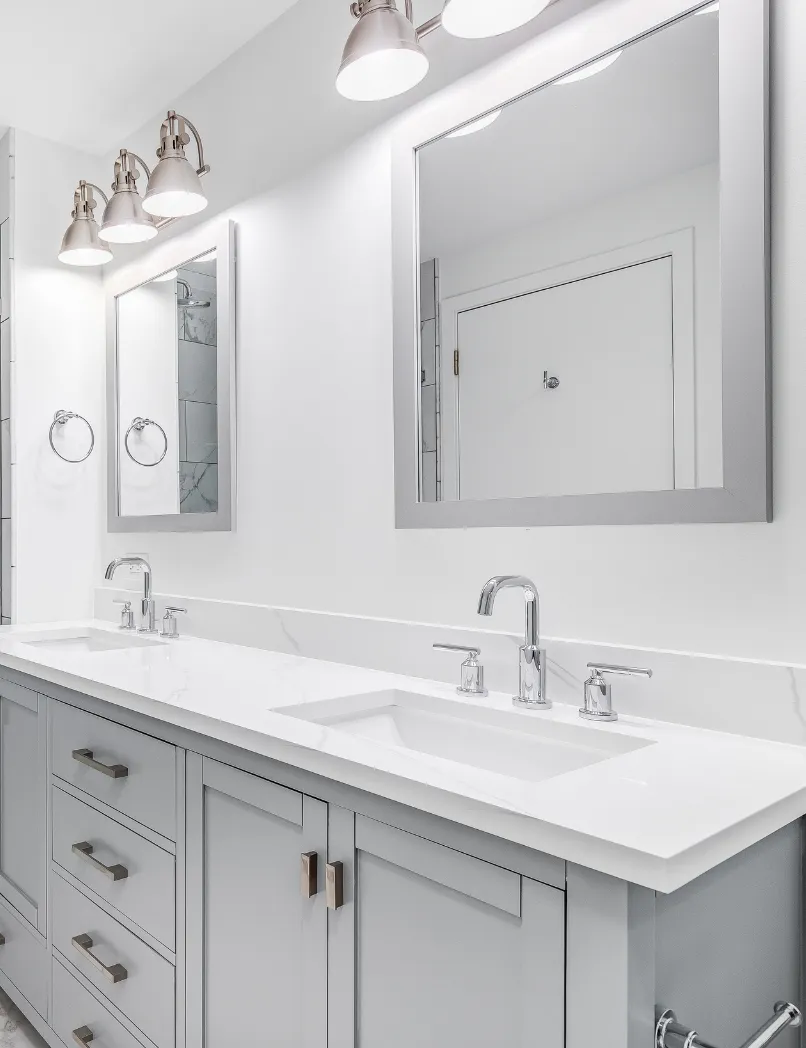 Bathroom remodeling cost guide in Los Angeles with double vanity, modern mirrors, updated lighting, quartz countertop, and clean bathroom finishes